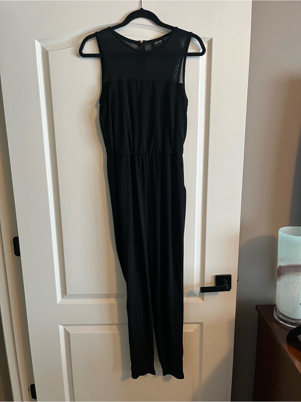 Nicole Black Sleeveless Jumpsuit with Sheer Yoke. Elegant yet playful.